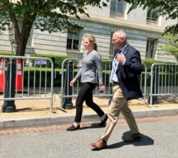 Minnesota Republican Congressman Pete Stauber and his staffer rush back from the Capitol to his office in the Cannon Building. (Carolyn Presutti/VOA News)