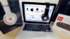FILE - Beats Audio equipment is arranged for a photo next to an Apple laptop at Best Buy in Boston. 