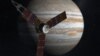 This NASA image shows an artist rendering of the Juno spacecraft circling Jupiter.