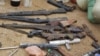 Confiscated weapons are displayed after a military raid on a hideout of suspected Islamist Boko Haram members in Nigeria's northern city of Kano, August 11, 2012.