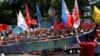 Demonstrators display a part of a fishing boat with anti-China protest signs during a rally by different activist groups over the South China Sea disputes, outside the Chinese Consulate in Makati City, Metro Manila, Philippines, July 12, 2016.