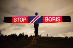 Anti-Brexit and anti-Boris Johnson messages are projected onto the Angel of the North sculpture in Gateshead, England, Sept. 3, 2019, in this picture obtained from social media on Sept. 4, 2019.