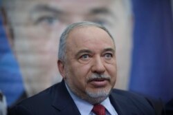 FILE - Former Israeli Defense Minister Avigdor Lieberman speaks to journalists during a press conference in Tel Aviv, Israel, May 30, 2019.