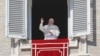 FILE - Pope Francis delivers a blessing from his studio window overlooking St. Peter's Square on the occasion of the Angelus noon prayer at the Vatican, Feb. 4, 2018. 