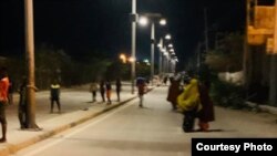 Residents run on an empty street during hours when exercise is allowed, amid a nationwide lockdown due to the coronavirus pandemic, in Mogadishu, Somalia. (Courtesy photo)