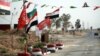Shia and Iraqi flags adorn Hashd Shaaby bases and were hung with more frequency in the run-up to the Sept. 25 independence referendum, a show of support for Baghdad in the disputed city on Sept. 26, 2017, outside of Kirkuk city. (H. Murdock / VOA)
