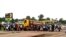 Crowd gathers near checkpoint, which controls the movement of people in and out of Ebola-hit regions, at the entrance to Bomi county in northwestern Liberia, Aug. 11, 2014.
