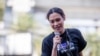 Pro-democracy protest fund-raiser Inthira Charoenpura speaks from a makeshift stage outside Bang Khen Metropolitan Police Station, Bangkok, Thailand, Dec. 21, 2020. 