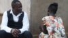 Caleb Ng'ombo, director of People Serving Girls at Risk, talks to "Maggie" a victim of child trafficking, in Neno district in southern Malawi.