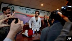 Taha Siddiqui, center, a reporter with France 24 and the Pakistan bureau chief for World Is One News, gives a press conference in Islamabad, Jan. 10, 2018. 