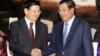 Cambodia's Prime Minister Hun Sen, right, shakes hands with his Laos Prime Minister Thongloun Sisoulith as they meet at Peace Palace, in Phnom Penh, Cambodia, Monday, June 27, 2016. Thongloun is on an official visit to Cambodia to further expand and strengthen the existing traditional relations of friendship, good neighborliness, and comprehensive cooperation between the two countries, according to a release. (AP Photo/Heng Sinith)