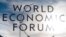 The sign of the World Economic Forum, WEF, is displayed at an entrance door at the congress center at the eve of the meeting in Davos, Sunday, Jan. 20, 2019. (AP Photo/Markus Schreiber)
