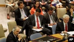 ویتالی چورکین (راست) نماینده روسیه و بشار جعفری نماینده سوریه در سازمان ملل