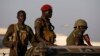 SPLA soldiers stand in a vehicle in Juba, South Sudan, December 20, 2013. 