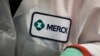 FILE - In this Feb. 28, 2013 file photo, a Merck logo is placed on scientist's lab coat in West Point, Pa. 