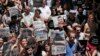 FILE - Protesters demonstrate against the jailing of two journalists and an academic, outside the offices of Ozgur Gundem, a pro-Kurdish publication, in Istanbul, June 21, 2016. 