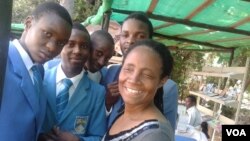 FILE: Jesesi Mungoshi, wife of renowned writer Charles Mungoshi, with students visiting the Zimbabwe International Book Fair. (Photo/Arthur Chigoriwa)
