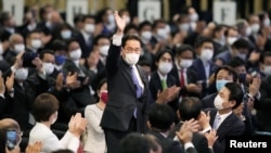 Foreign Minister Fumio Kishida gestures as he is elected as new head of the ruling party in Tokyo, Japan, Sep. 29, 2021.