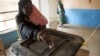 A woman casts her ballot during Darfur's referendum at a registration center at Al Fashir in North Darfur, Sudan, April 12, 2016. 