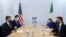 US Secretary of State Antony Blinken, left, sits opposite Italian Foreign Minister Luigi Di Maio, during a meeting on the first day of the G7 foreign ministers' summit, in Liverpool, England, Dec. 11, 2021. 