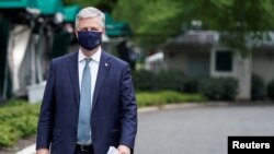 FILE - White House National Security Adviser Robert O'Brien walks after being interviewed at the White House in Washington, May 24, 2020.