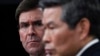Defense Secretary Mark Esper, left, listens as South Korean National Defense Minister Jeong Kyeong-doo, right, speaks during a news conference at Pentagon in Washington, Monday, Feb. 24, 2020. (AP Photo/Susan Walsh)