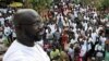 George Weah, a former soccer star and the running mate of presidential candidate Winston Tubman of the Congress for Democratic Change (CDC), stands at the balcony after a news conference at his headquarters in Monrovia, November 5, 2011