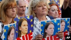 People rally in support of Lyudmyla Kozlovska, a Ukrainian activist banned from the entire Schengen zone due to a Polish request, in Warsaw, Poland, on Aug. 23, 2018.