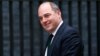 FILE - Ben Wallace, who then was parliamentary undersecretary of state for the Northern Ireland Office, is pictured as he arrives for a cabinet meeting at 10 Downing Street in London, May 12, 2015.