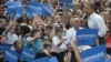 President Barack Obama walks on stage as he is introduced at a campaign event at St. Petersburg College-Seminole Campus at the Natural Habitat Park Field, Saturday, Sept. 8, 2012, in St. Petersburg, Florida.