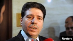 Perdana Menteri Suriah Wael al-Halki berbicara kepada wartawan di Damaskus (foto: dok).