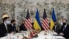 Ukrainian Foreign Minister Dmytro Kuleba, left, meets with United States Secretary of State Antony Blinken, right, in Brussels, Belgium, April 13, 2021.