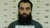 FILE - Anas Haqqani, a senior leader of the Haqqani network, arrested by the Afghan Intelligence Service (NDS) in Khost province is seen in this handout picture released October 16, 2014. 