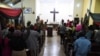 FILE - People worship at the Anglican Church of Redemption, Diocess of Lagos West, Ibafo in Ogun State, southwest Nigeria, Jan. 1, 2021. A report by a U.S-based monitoring group says Nigeria became the world's biggest killing spot for Christians in 2020.