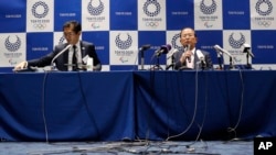 Tokyo 2020 Organizing Committee CEO Toshiro Muto, right, speaks during a news conference after a Tokyo 2020 Executive Board Meeting in Tokyo Monday, March 30, 2020. Tokyo Olympic President Yoshiro Mori said Monday he expects to talk with IOC…