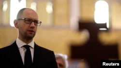 Ukrainian Prime Minister Arseniy Yatsenyuk visits the Santa Sophia Church in Rome, Apr. 26, 2014. 