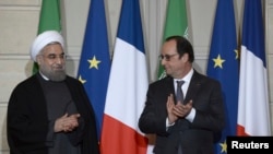 حسن روحانی رئیس جمهوری ایران و فرانسوا اولاند رئیس جمهوری فرانسه در کاخ الیزه در پاریس