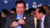 Prime Minister Hun Sen views his phone during the 65th annual celebration of ruling party Cambodian People's Party (CPP) establishment on Tuesday, June 28, 2016, at CPP's headquarter in Phnom Penh, Cambodia. (Leng Len/VOA Khmer) 