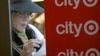 A woman fills out an application for one of the 300 available positions at a new Target retail store in San Francisco, California, August 9, 2012. 