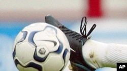 Soccer player kicking ball