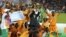 Ivory Coast players celebrate with the trophy after winning their African Football Cup of Nations final against Ghana in Bata, Equatorial Guinea, Feb. 8, 2015. The tournament returns to Gabon for the second time in five years beginning Jan. 14, 2017.