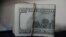 FILE - A view of U.S. dollar bills