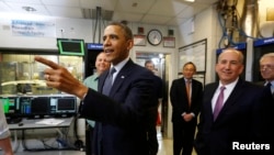 U.S. President Barack Obama tours the Argonne National Lab near Chicago, March 15, 2013. 