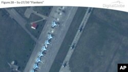 По утверждению НАТО, на снимке истребители СУ-27 на базе Приморско-Ахтарск. Снимок Digital Globe 22 марта 2014 г. Обнародован НАТО 9 апреля.