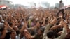 Egyptian anti-Mubarak protesters react in Cairo's Tahrir square on June 2, 2012. 