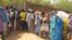 FILE- Cameroonian internally displaced queue at a camp in Kolofata, in the extreme north of Cameroon, for a food distribution provided by the International Red Cross Committee (ICR) on Feb. 22, 2017.