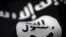 FILE - An Islamic State flag is seen in this undated photo illustration.