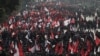 Protesters affiliated with a faction of the ruling Nepal Communist Party take part in a rally against the dissolution of parliament, in Kathmandu, Nepal Dec. 29, 2020.