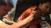 A Cambodian prison authority pushed Ny Sokha, Adhoc's head of monitoring, into a car after the appeal court had announced its verdict on Friday September 02, 2016. (Kann Veichika/VOA Khmer)
