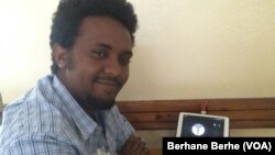 A vendor carrying a sack of leafy vegetables wades across a flooded market place after heavy rainfall in Lahore, Pakistan.